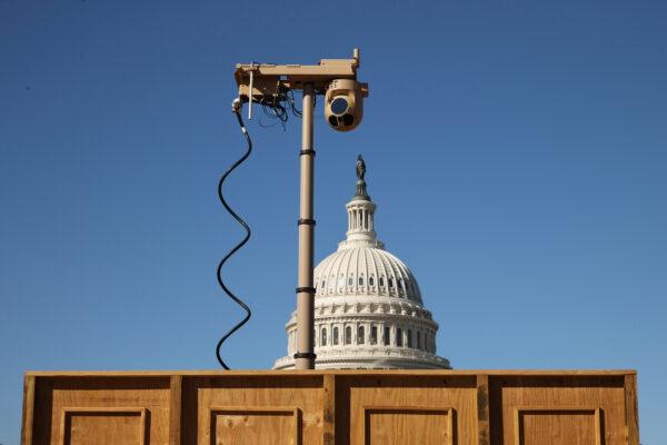 A temporary, mobile surveillance tower is surrounded by a wood fence as it stands on the east side of the U.S. Capitol on Oct. 19, 2021. (Chip Somodevilla/Getty Images)