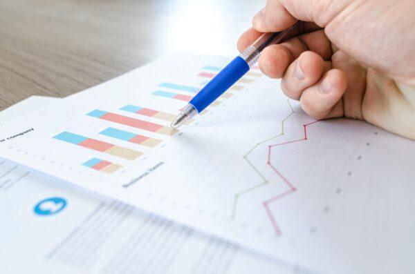Stock photo of data charts on paper. (Lukas/Pexels)