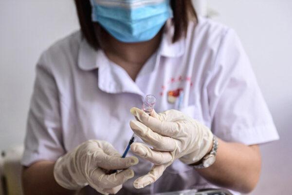 A medical staff member prepares a dose of the Sinovac COVID-19 vaccine in Shenyang, in China's northeastern Liaoning Province on Aug.1, 2021. (STR/AFP via Getty Images)