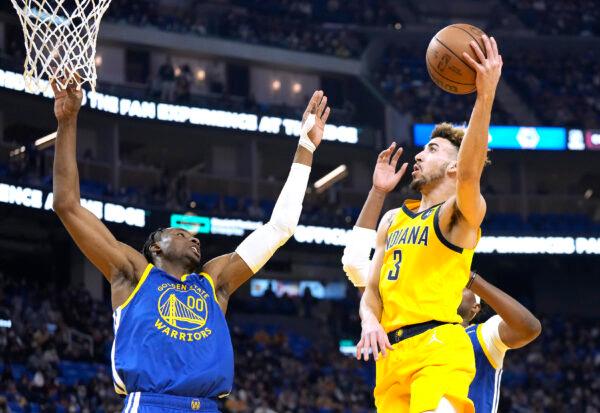 Chris Duarte #3 of the Indiana Pacers shoots and scores over Jonathan Kuminga #00 of the Golden State Warriors during the first half of an NBA basketball game at Chase Center, in San Francisco, on January 20, 2022. (Thearon W. Henderson/Getty Images)