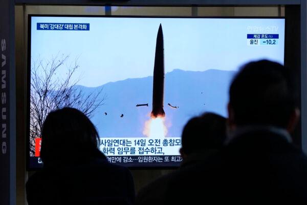 People watch a TV showing a file image of North Korea's missile launch during a news program at the Seoul Railway Station in Seoul, South Korea, on Jan. 20, 2022. (Ahn Young-joon/AP Photo)