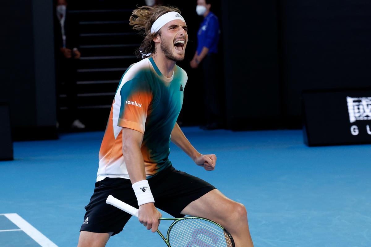 Stefanos Tsitsipas of Greece celebrates after defeating Benoit Paire of France in their third round match at the Australian Open tennis championships in Melbourne, on Jan. 22, 2022. (Hamish Blair/AP Photo)