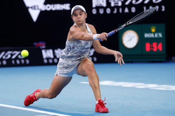 Ash Barty of Australia makes a backhand return to Amanda Anisimova of the United States during their fourth round match at the Australian Open tennis championships in Melbourne, Australia, on Jan. 23, 2022. (Hamish Blair/AP Photo)