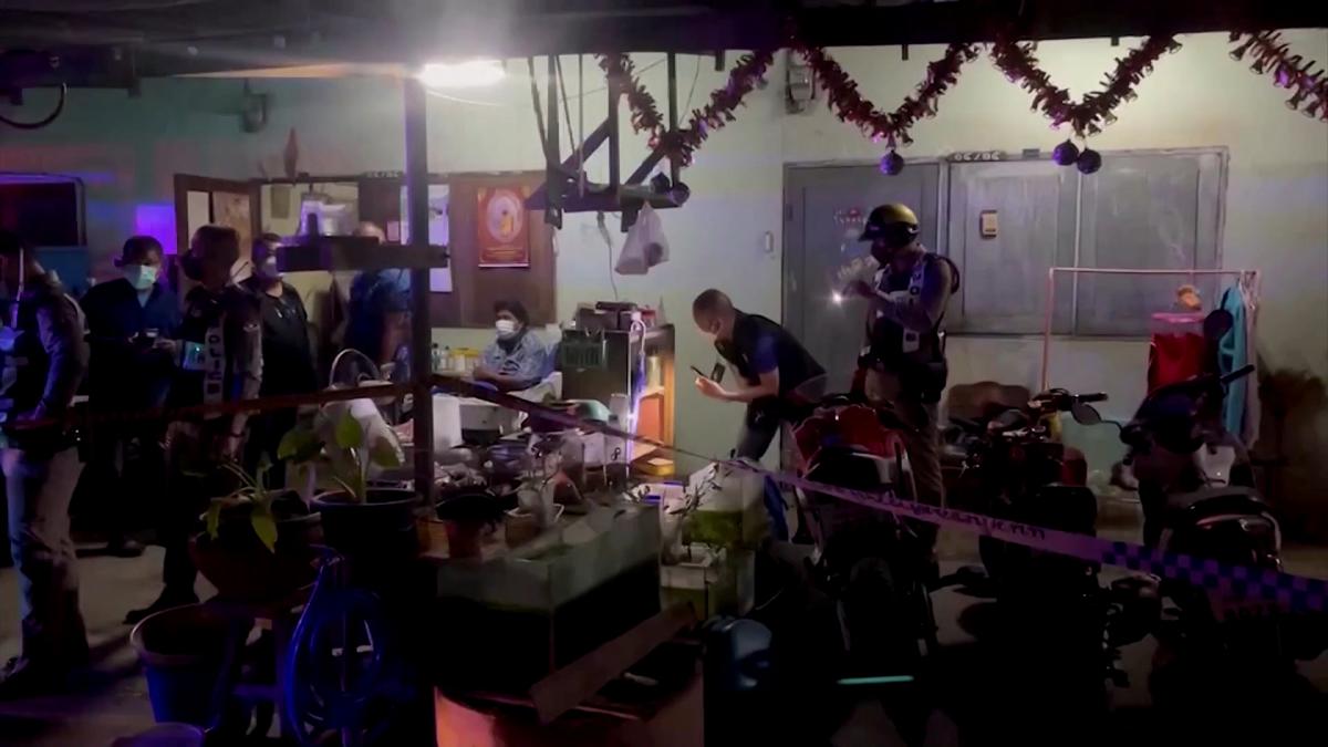 Police and forensic examiners collecting evidence at the scene where a 49-year-old British man was found dead at his home in western Thailand, on Jan. 23, 2022, in a still from a video. (Reuters/Screenshot via The Epoch Times)