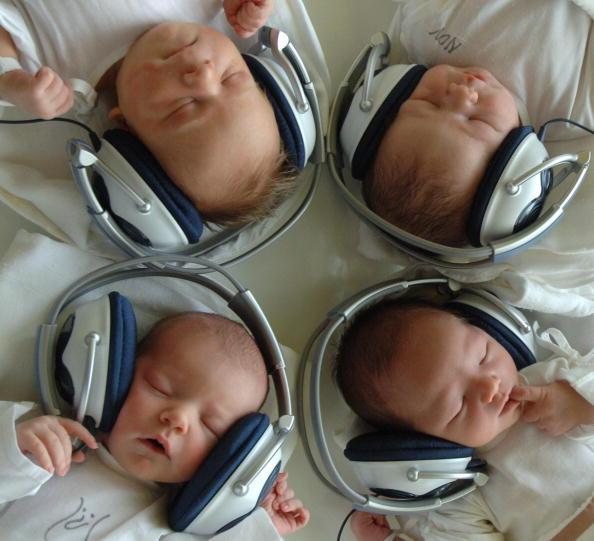 One and Two-day-old newborn babies listen to music with headphones at the 1st Private Hospital in eastern Slovak metropol of Kosice-Saca 11 August 2005. The experimental program is based on using musical therapy to help stimulate the communication, adaptation and ease the stress after the birth. (Photo credit should read JOE KLAMAR/AFP via Getty Images)<em style="font-size: 16px;"> </em>
