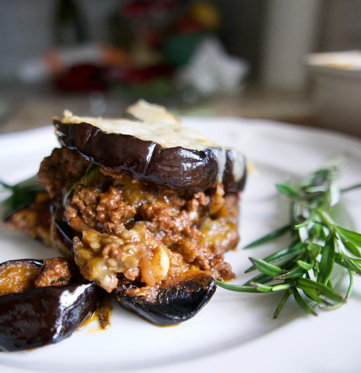 Layers of baked eggplant sandwich a rich, fragrant lamb sauce in this lighter take on a Greek classic. (Victoria de la Maza)