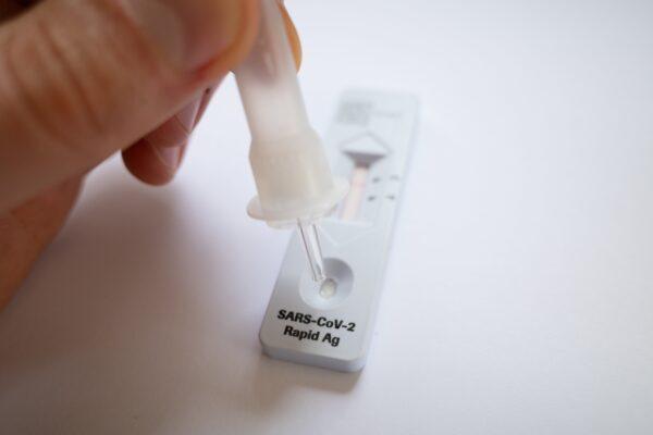 A generic image of a person using a SARS CoV-2 Rapid Antigen Test in Canberra, Australia, on Nov. 2, 2021. (AAP Image/Lukas Coch)