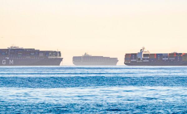 Cargo ships wait outside the ports of Los Angeles and Long Beach on Oct. 27, 2021. (John Fredricks/The Epoch Times)