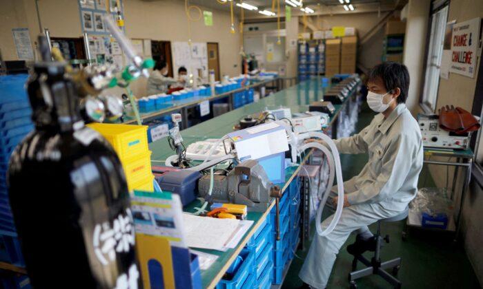 Japan January Factory Growth Hits Four-Year High, but Services Contract-Flash PMI