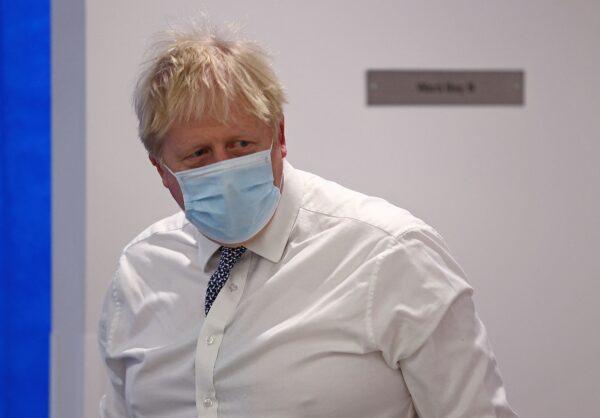 Britain's Prime Minister Boris Johnson reacts during his visit to Milton Keynes University Hospital, north of London, on Jan. 24, 2022. (Adrian Dennis/Pool/AFP via Getty Images)
