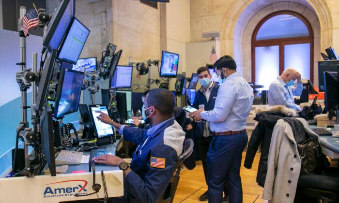 Traders work on the New York Stock Exchange floor in New York on Jan. 25, 2022. (Ted Shaffrey/AP Photo)