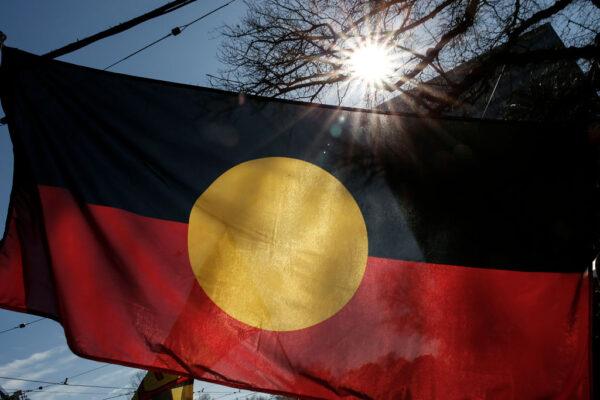The Aboriginal Flag is seen flying during the NAIDOC March in Melbourne, Australia, in July 2005. (Photo by Darrian Traynor/Getty Images)