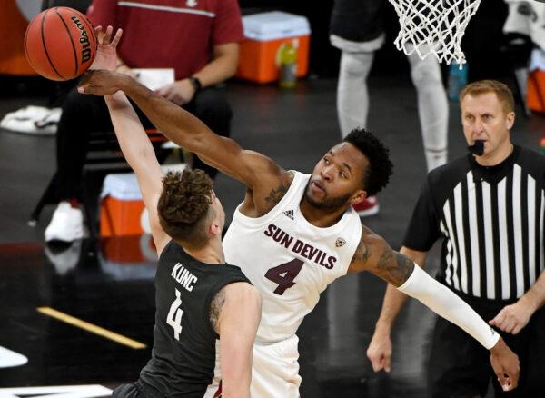 Kimani Lawrence #4 of the Arizona State Sun Devils blocks a shot by Aljaz Kunc #4 of the Washington State Cougars during the first round of the Pac-12 Conference basketball tournament at T-Mobile Arena in Las Vegas, Nevada on March 10, 2021. (Ethan Miller/Getty Images)