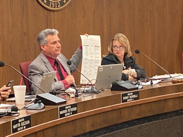 Arizona State Sen. Sonny Borrelli holds up a sample of the current ballot at a hearing of the Arizona Committee on Government in Phoenix on Jan. 24, 2022. Borrelli is the lead sponsor of a bill to establish currency-grade ballot security measures. (Allan Stein/The Epoch Times)