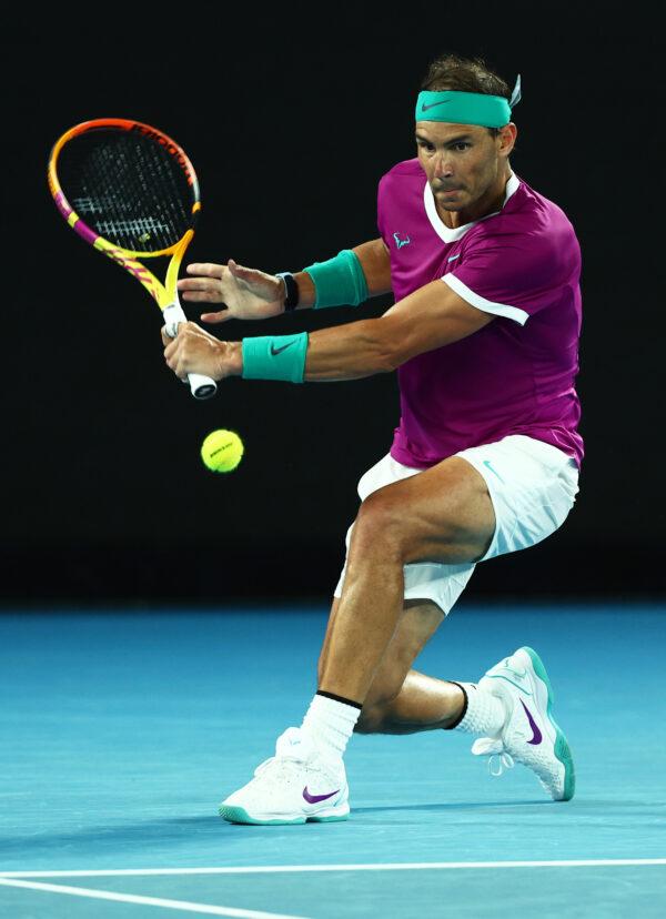 Rafael Nadal of Spain plays a backhand during his third round singles match against Karen Khachanov of Russia during day five of the 2022 Australian Open at Melbourne Park in Melbourne, Australia, on Jan. 21, 2022. (Clive Brunskill/Getty Images)