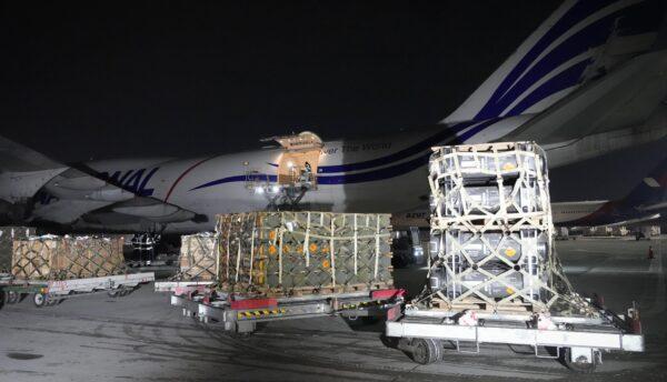 Workers unload a shipment of military aid delivered as part of the United States of America's security assistance to Ukraine, at the Boryspil airport, outside Kyiv, Ukraine, on Jan. 25, 2022. (Efrem Lukatsky/AP Photo)