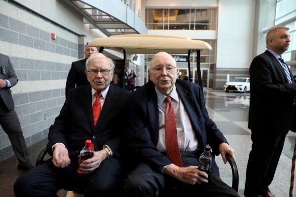 Berkshire Hathaway Chairman Warren Buffett (left) and Vice Chairman Charlie Munger are seen at the annual Berkshire shareholder shopping day in Omaha, Neb., on May 3, 2019. (Scott Morgan/Reuters)