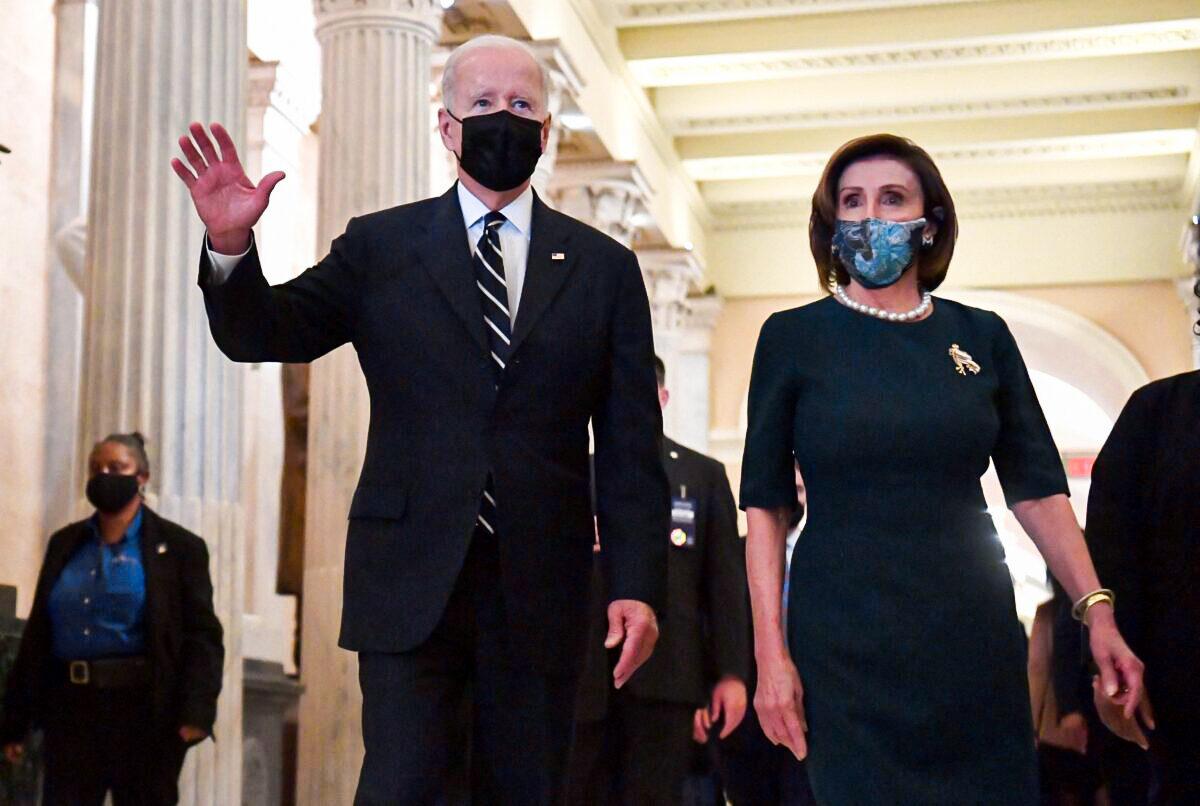 President Joe Biden and Speaker of the House Nancy Pelosi depart following a meeting with the Democratic caucus at the U.S. Capitol on Oct. 28, 2021. (Nicholas Kamm/AFP via Getty Images)