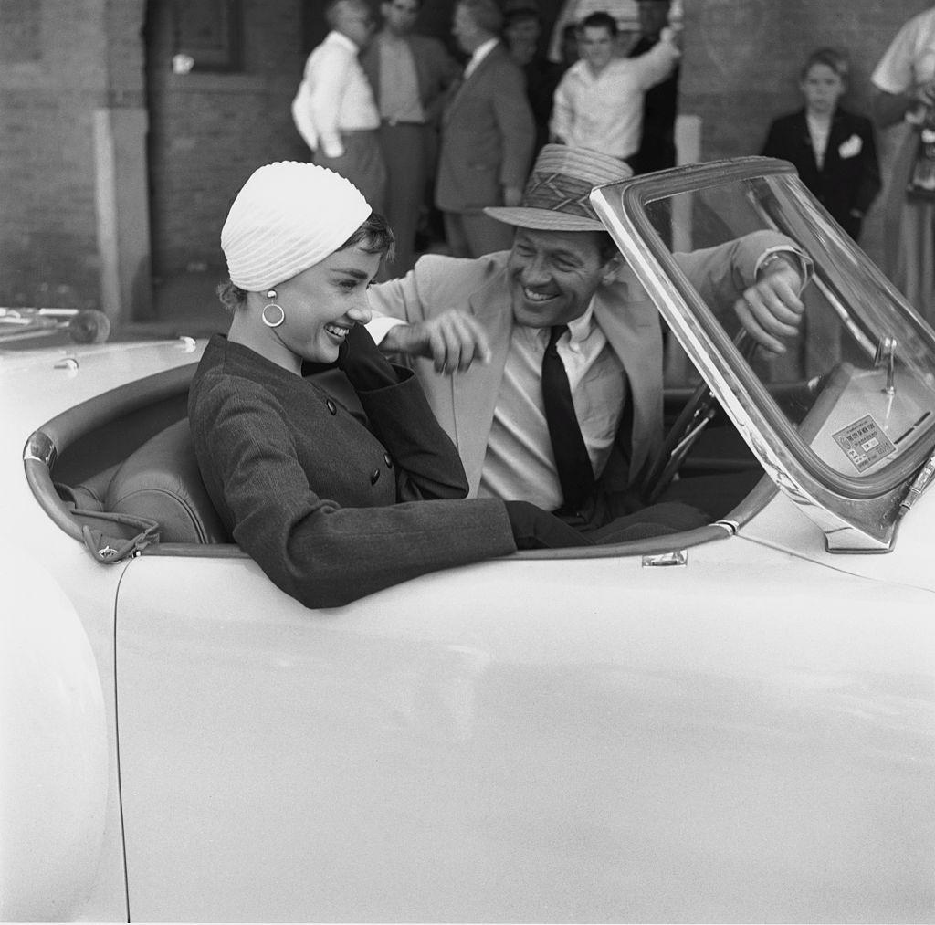 Actors Audrey Hepburn and William Holden in a Nash-Healey roadster on the set “Sabrina.” in New York in October 1953. (Archive Photos/Getty Images)