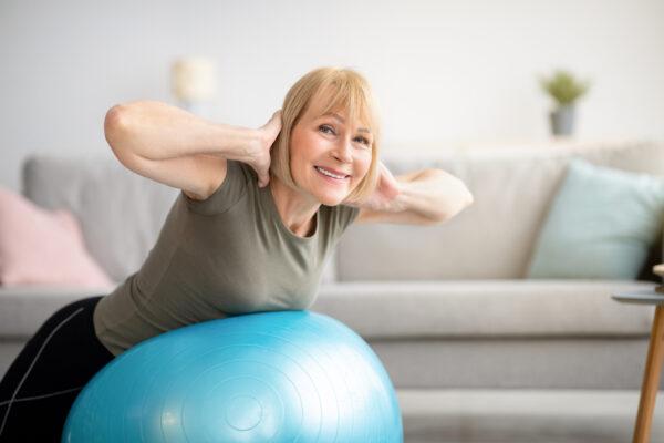 In women who are at a risk for osteoporosis, back strengthening exercises are especially beneficial and can provide lasting protection against spinal fractures. By Prostock-studio/Shutterstock