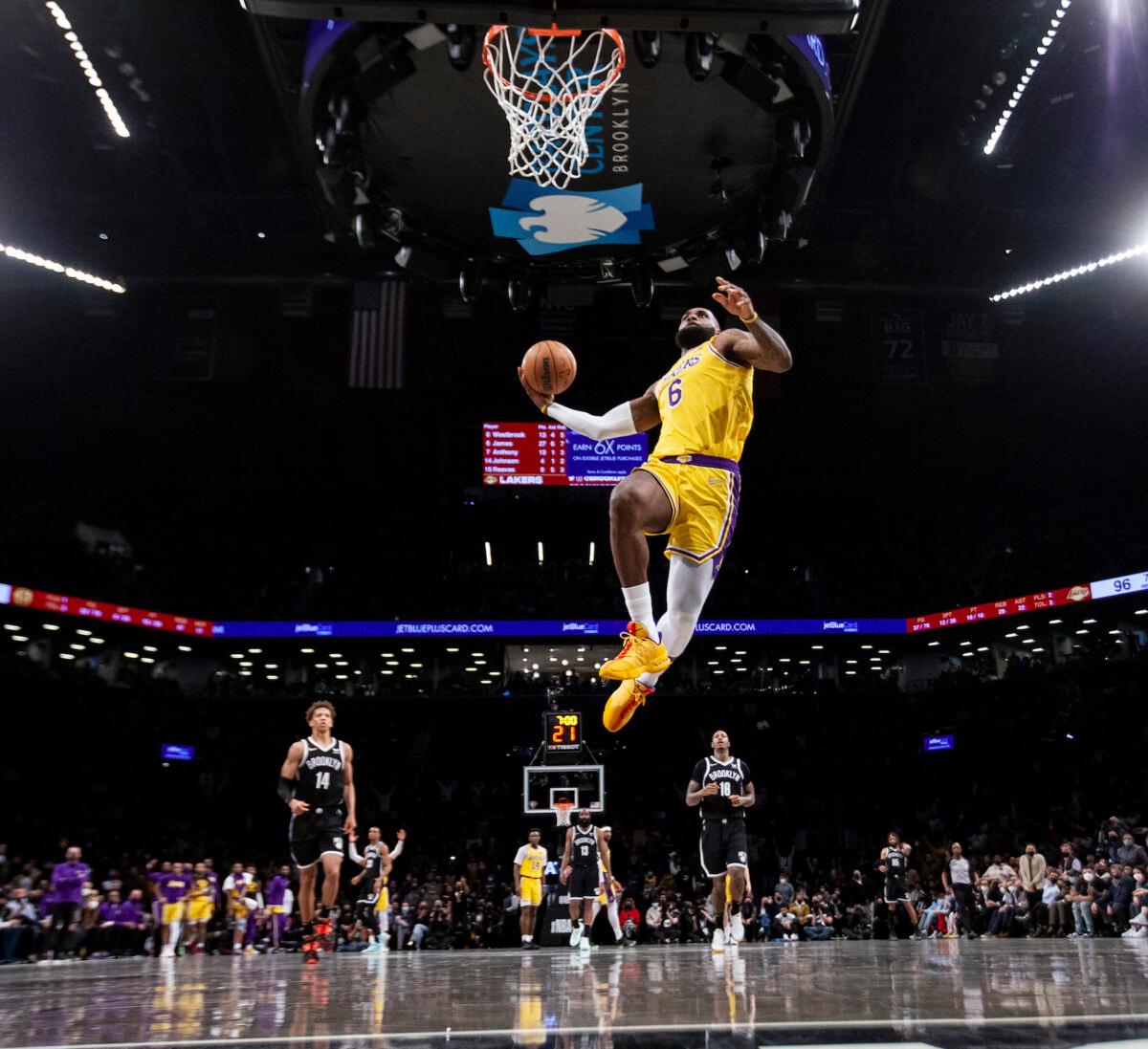 LeBron James #6 of the Los Angeles Lakers dunks against the Brooklyn Nets at Barclays Center, in New York City, on Jan. 25, 2022. (Michelle Farsi/Getty Images)