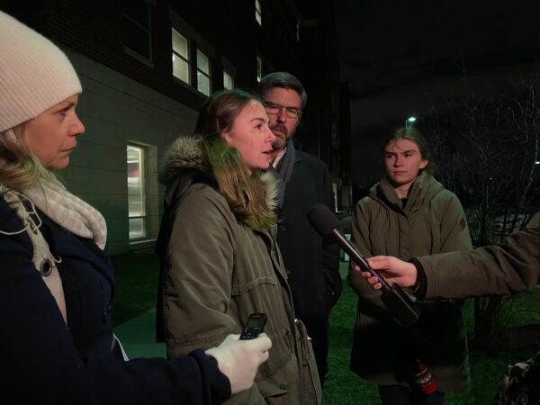 Erin (L), Caroline (2nd L), Clint, and Laura Thomas speak to reporters outside the Loudoun County Public Schools administration building in Ashburn, Va., on Jan. 25, 2022. (Terri Wu/The Epoch Times)