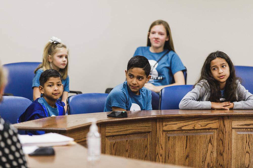 (L–R) Front: Cristian, Xavier, Marie; Back: Hannah, Kennedi in the courtroom. (Courtesy of Micah Schmidt/Double Knot Photography via Jake Mills)