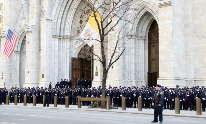 Hundreds of Police Turn Out to Wake of First of Two Slain NYPD Officers