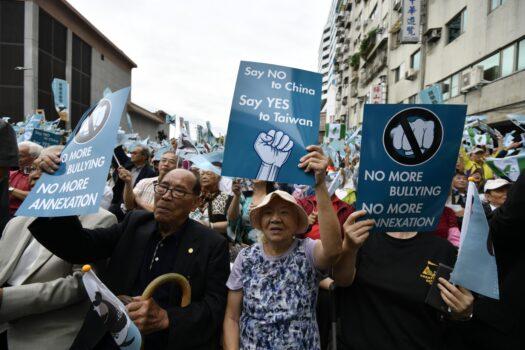 Pro-Taiwan independence activists call for the referendum in front of the headquarters of the ruling Democratic Progressive Party during a demonstration in Taipei on Oct. 20, 2018. (Sam Yeh/AFP via Getty Images)