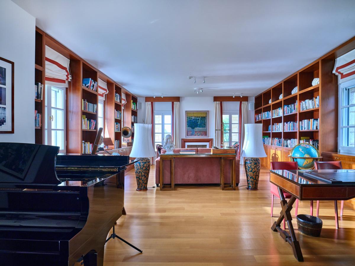 The library/music room, media room, and other villa spaces are designed to be luxurious, and ergonomic at the same time. The villa is intended for entertaining, but also as a welcoming home. (Courtesy of Greece Sotheby's International Realty)