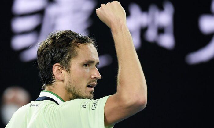 Daniil Medvedev of Russia reacts after winning the third set against Stefanos Tsitsipas of Greece, during their semifinal match at the Australian Open tennis championships in Melbourne, on Jan. 28, 2022. (Andy Brownbill/AP Photo)