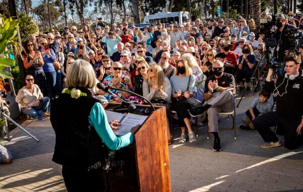 Joyce Hoffman speaks at the unveiling of her dedicated statue at Watrerman's Plaza in Dana Point, Calif., on Jan. 27, 2022. (John Fredricks/The Epoch Times)