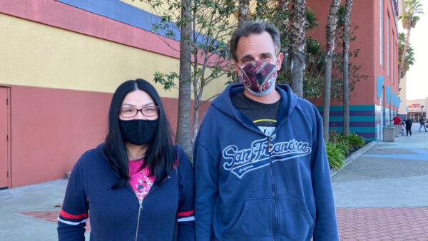 Ms. Xiang and Marc Frost stand outside the Century 25 Theater in Union City, Calif., on Jan. 25, 2022. (Ilene Eng/The Epoch Times)