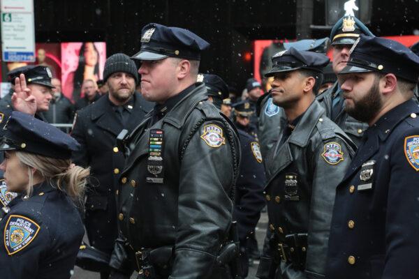 Somber faces among police colleagues outside St Patrick's Cathedral in New York at the Jan. 28 funeral service of officer Jason Rivera who was fatally shot while on duty on Jan. 21, 2022. (Richard Moore/The Epoch Times)