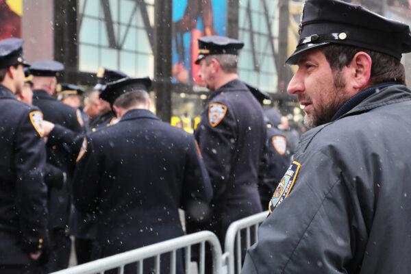 There were many moments for reflection by police during the funeral of slain officer Jason Rivera. on Jan. 28, 2022. (Richard Moore/The Epoch Times)