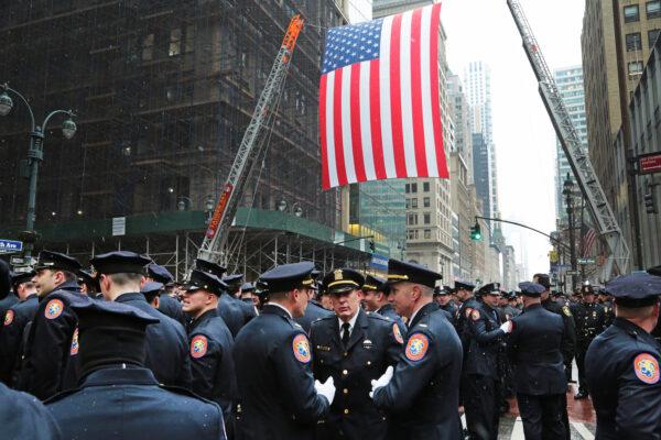 A sea of blue uniforms stretched at least seven city blocks in New York during slain officer Jason Rivera's funeral at St Patrick's Cathedral on Jan. 28, 2022. (Richard Moore/The Epoch Times)