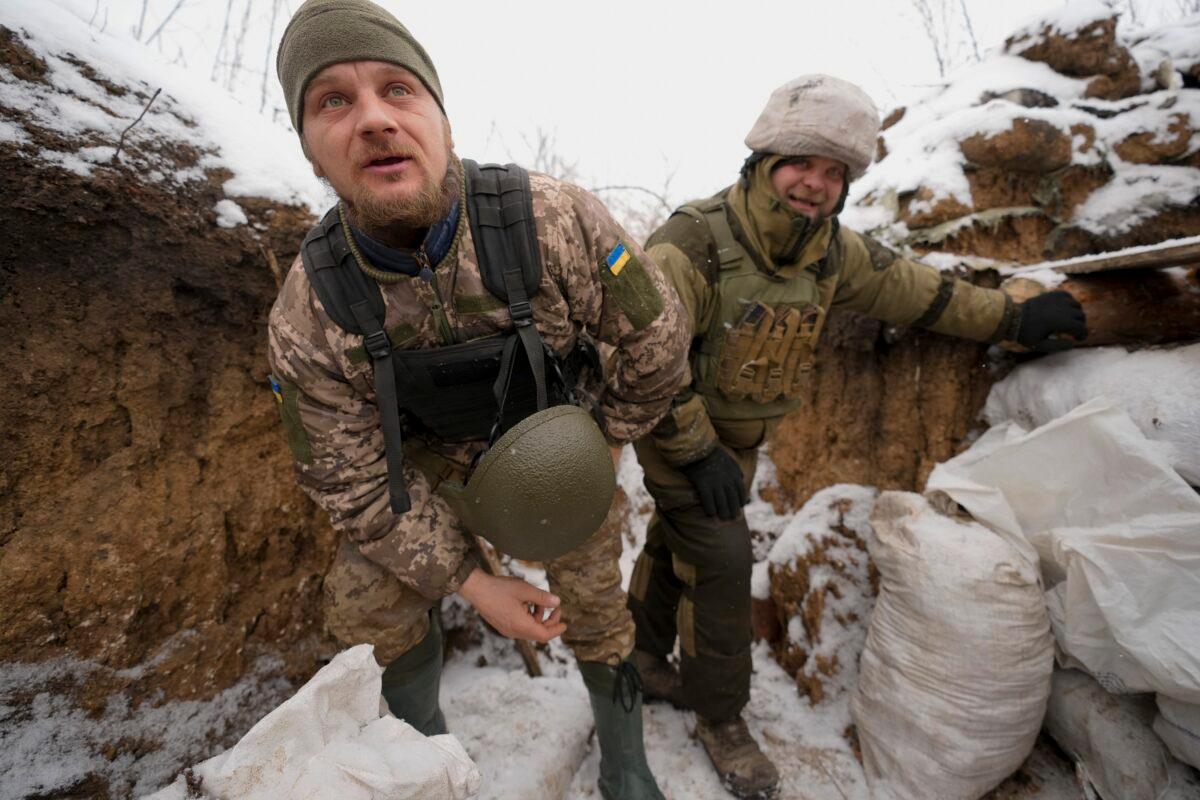 Ukrainian servicemen check their position in a trench on the front line in the Luhansk region, eastern Ukraine on Jan. 28, 2022. (Vadim Ghirda/AP Photo)