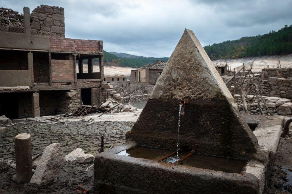 A fountain still runs in the ruined ghost town of Aceredo. (Miguel Riopa/AFP via Getty Images)