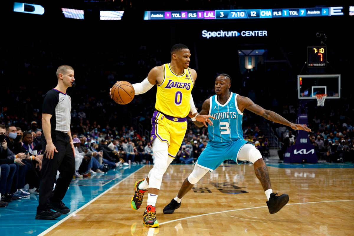 Russell Westbrook #0 of the Los Angeles Lakers dribbles against Terry Rozier #3 of the Charlotte Hornets during the first half of the game at Spectrum Center, in Charlotte, on Jan. 28, 2022. (Jared C. Tilton/Getty Images)