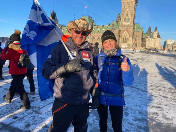 Supporters of the truck convoy protesting COVID-19 restrictions and mandates gather near the Parliament Hill in Ottawa on Jan. 28, 2022. (Jonathan Ren/The Epoch Times)