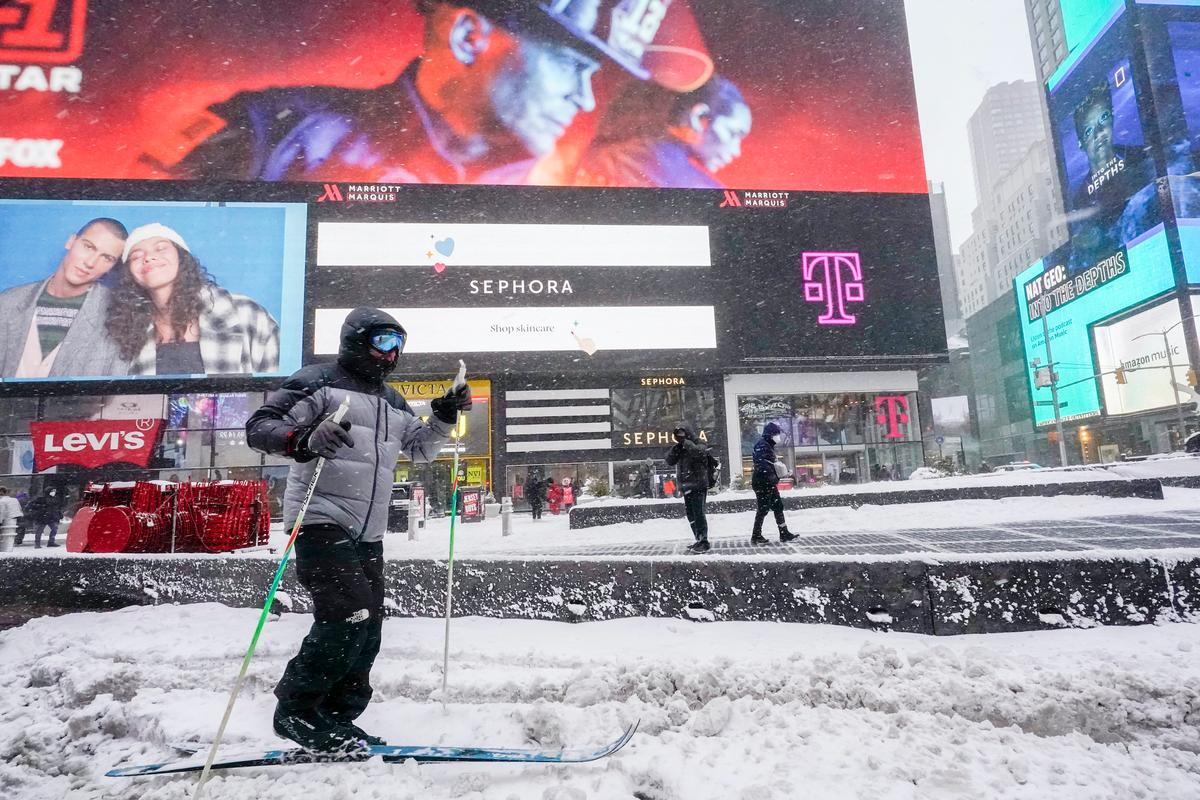 A person cross country skis through New York's Times Square during a snow storm on Jan. 29, 2022. (Mary Altaffer/AP Photo)