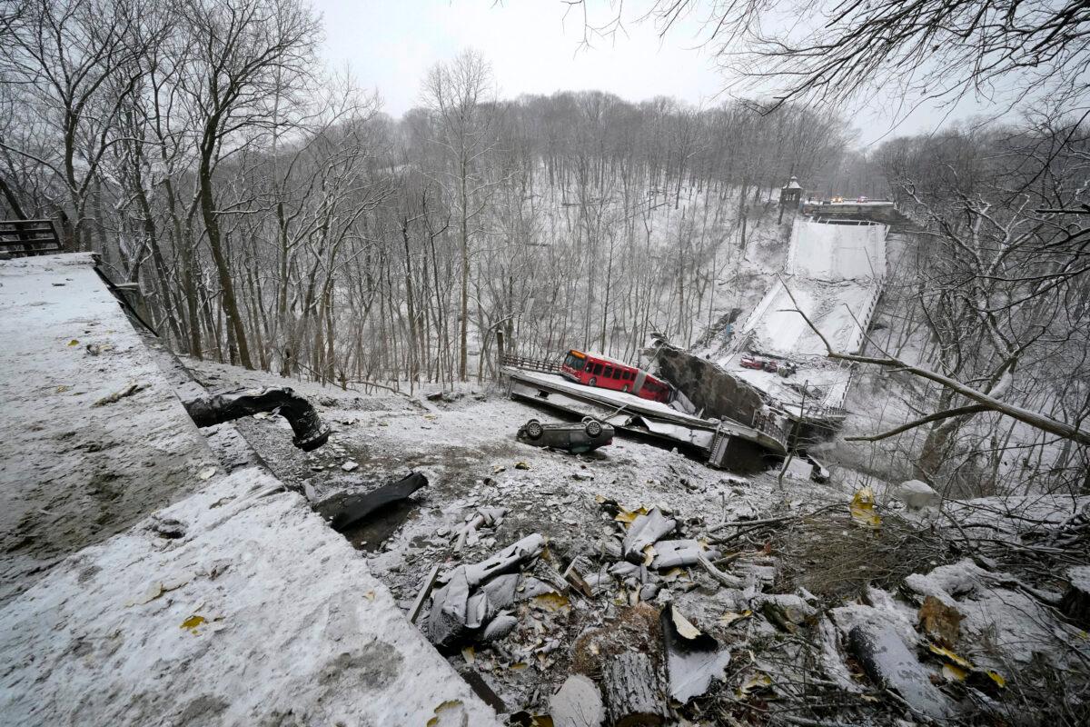 A Port Authority bus was on a bridge when it collapsed in Pittsburgh's East End, shutting down barge traffic on the upper Ohio River, on Jan. 28, 2022. (AP Photo/Gene J. Puskar)