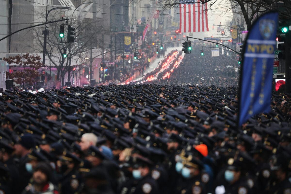 Thousands of police officers from around the country gather at St. Patrick's Cathedral to attend the funeral for fallen NYPD Officer Jason Rivera in New York City on Jan. 28, 2022. The 22-year-old NYPD officer was shot and killed on Jan. 21 in Harlem while responding to a domestic disturbance call. Rivera's partner, Officer Wilbert Mora, also died from injuries suffered in the shooting. (Spencer Platt/Getty Images)