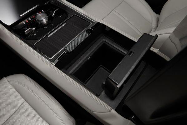 Center console with control panel and storage bin. (Courtesy of Stellantis)