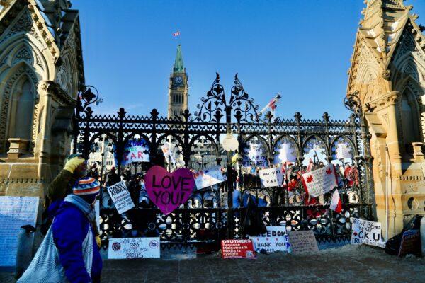 Signs placed by the Parliament as demonstrators protest against COVID-19 mandates and restrictions in Ottawa on Jan. 31, 2022. (Jonathan Ren/The Epoch Times)