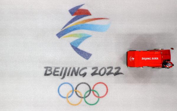 An ice machine prepares the field of play for training sessions of short track speed skating teams at the Capital Indoor Stadium ahead of the Beijing 2022 Winter Olympics in Beijing, on Jan. 30, 2022. (Fabrizio Bensch/Reuters)