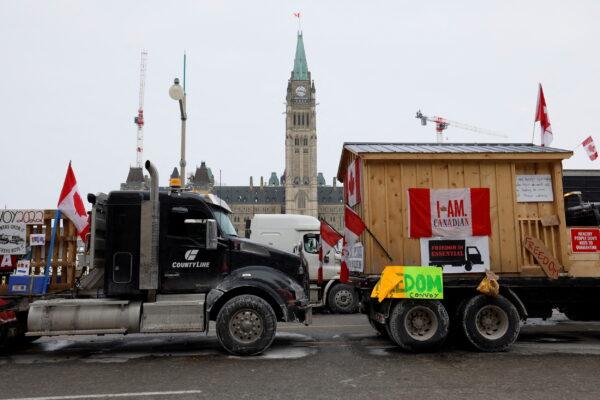 Vehicles displaying protest signs are seen outside Parliament Hill in Ottawa on Jan. 31, 2022. (Reuters/Blair Gable)