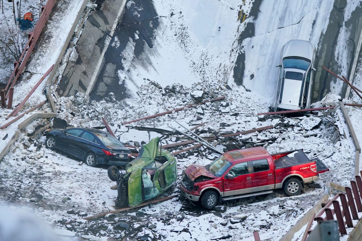 Vehicles that were on a bridge when it collapsed Friday are seen in the rubble during the recovery process in Pittsburgh's East End., on Jan. 31, 2022. (Gene J. Puskar/AP Photo)