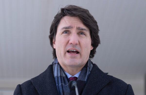 Canadian Prime Minister Justin Trudeau responds to a reporters question as he participates in a media availability held at a location in the National Capital Region which is not being made public for security reasons, Monday, January 31, 2022. (The Canadian Press/Adrian Wyld)