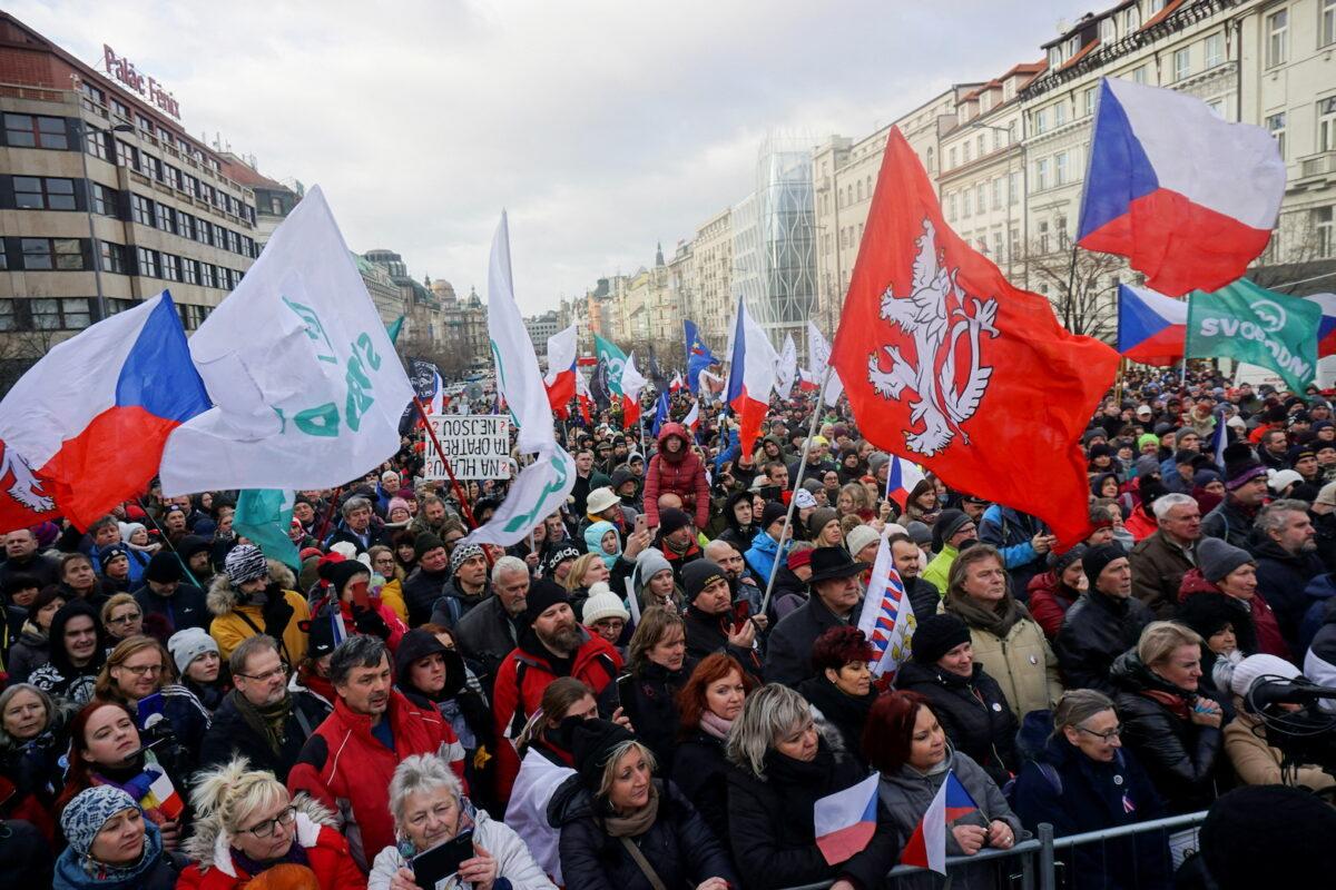 Demonstrators wave flags during a protest against the Czech government's COVID-19 restrictions in Prague on Jan. 30, 2022. (Jiri Skacel/Reuters)